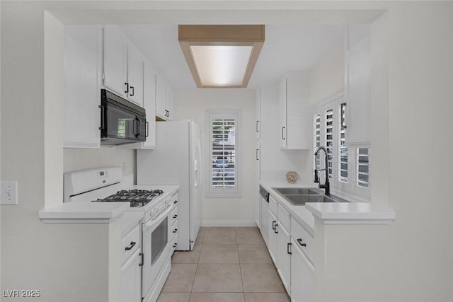 4843 S Torrey Pines Dr Unit 101, Las Vegas, NV 89103 - kitchen with white appliances, light countertops, white cabinets, a sink, and light tile patterned flooring