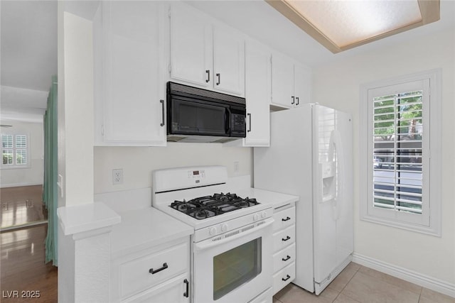 4843 S Torrey Pines Dr Unit 101, Las Vegas, NV 89103 - kitchen featuring white appliances, light countertops, white cabinetry, and baseboards