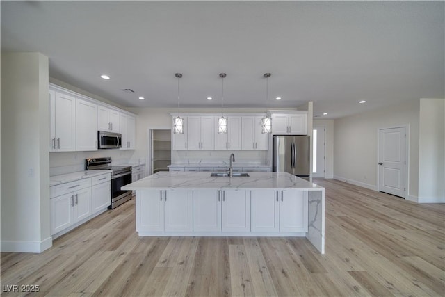 4861 Ridgewood, Pahrump, NV 89061 - kitchen featuring stainless steel appliances, a sink, white cabinetry, light wood-style flooring, and recessed lighting