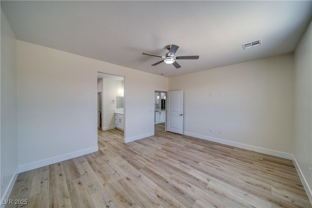 4861 Ridgewood, Pahrump, NV 89061 - unfurnished bedroom with light wood-type flooring, baseboards, connected bathroom, and ceiling fan