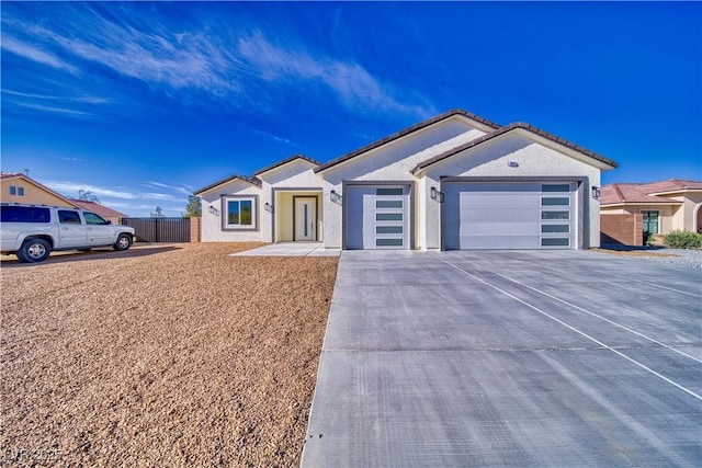 4861 Ridgewood, Pahrump, NV 89061 - ranch-style home featuring an attached garage, concrete driveway, stucco siding, and a tiled roof