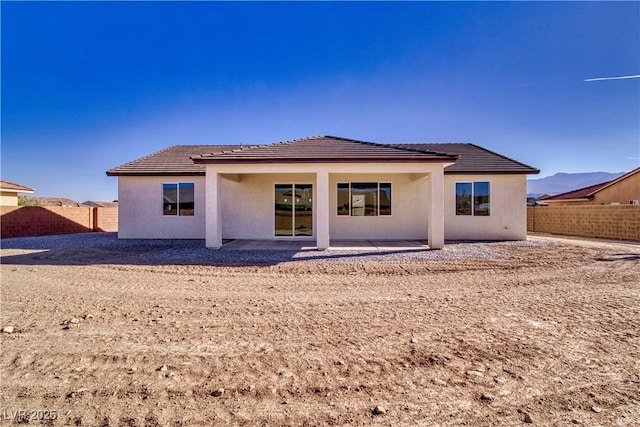 4861 Ridgewood, Pahrump, NV 89061 - rear view of property with a tile roof, a fenced backyard, and a patio