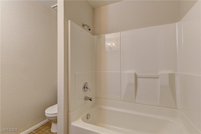 3145 E Flamingo Rd Unit 2080, Las Vegas, NV 89121 - bathroom with toilet,  shower combination, baseboards, and a textured wall