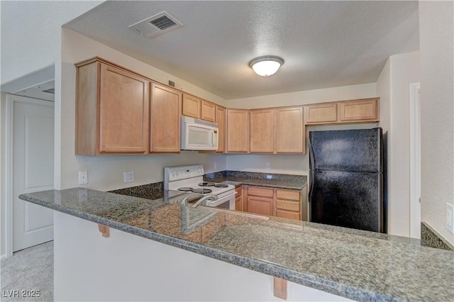 3145 E Flamingo Rd Unit 2080, Las Vegas, NV 89121 - kitchen with white appliances, a peninsula, dark stone counters, light brown cabinets, and a textured ceiling