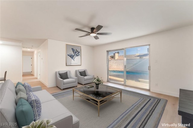 4301 Fortune Ave, Las Vegas, NV 89107 - living room with wood finished floors, a ceiling fan, and baseboards