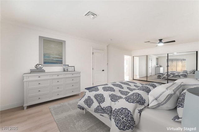 4301 Fortune Ave, Las Vegas, NV 89107 - bedroom with crown molding, light wood-style floors, and ceiling fan
