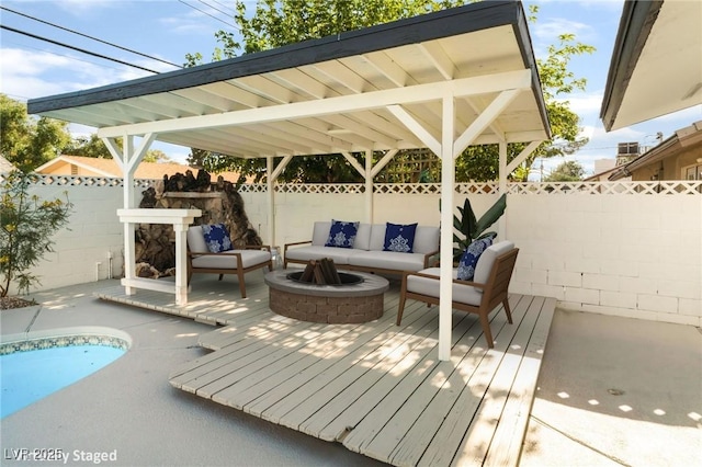 4301 Fortune Ave, Las Vegas, NV 89107 - wooden deck featuring a fenced backyard and an outdoor living space with a fire pit