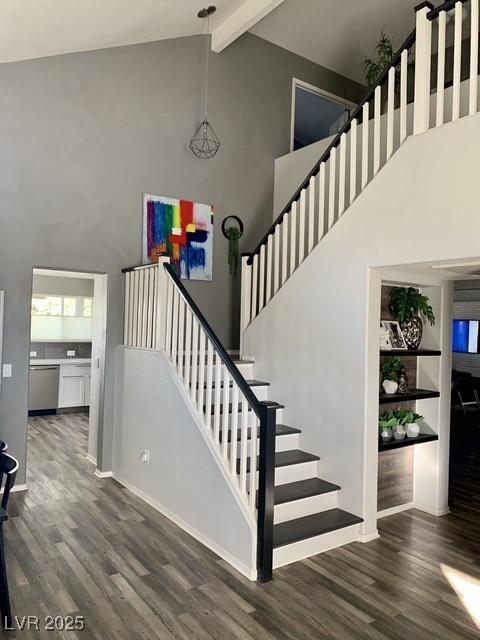 9485 Supernova Ct, Las Vegas, NV 89123 - stairs with high vaulted ceiling, wood finished floors, and beamed ceiling