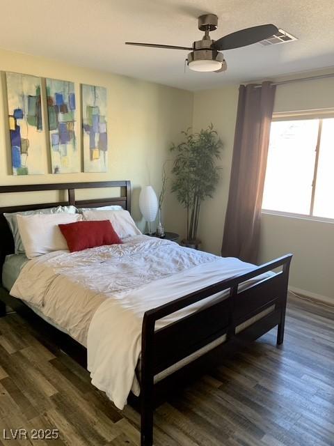 9485 Supernova Ct, Las Vegas, NV 89123 - bedroom with wood finished floors and a ceiling fan