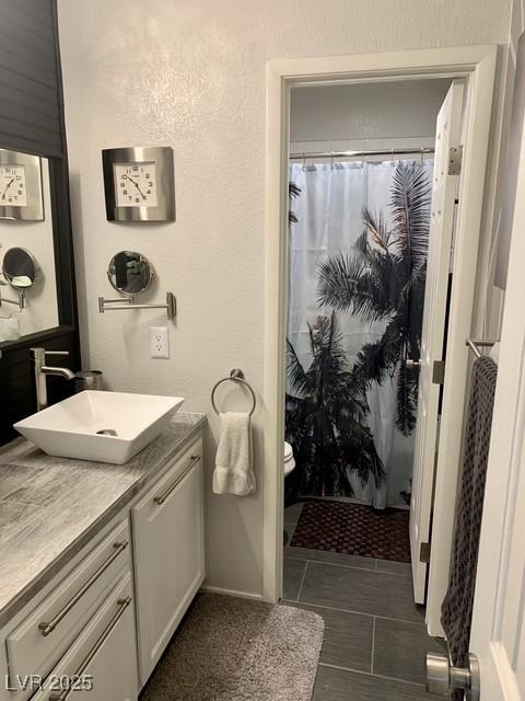 9485 Supernova Ct, Las Vegas, NV 89123 - bathroom featuring vanity and curtained shower