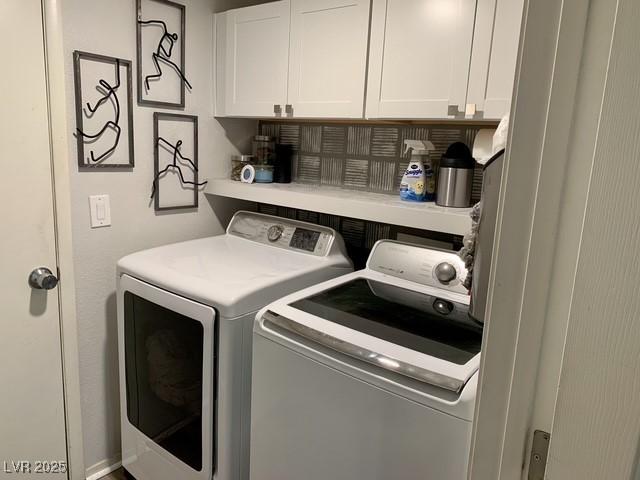 9485 Supernova Ct, Las Vegas, NV 89123 - laundry room with washer and clothes dryer and cabinet space