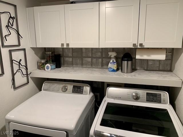9485 Supernova Ct, Las Vegas, NV 89123 - washroom featuring separate washer and dryer and cabinet space