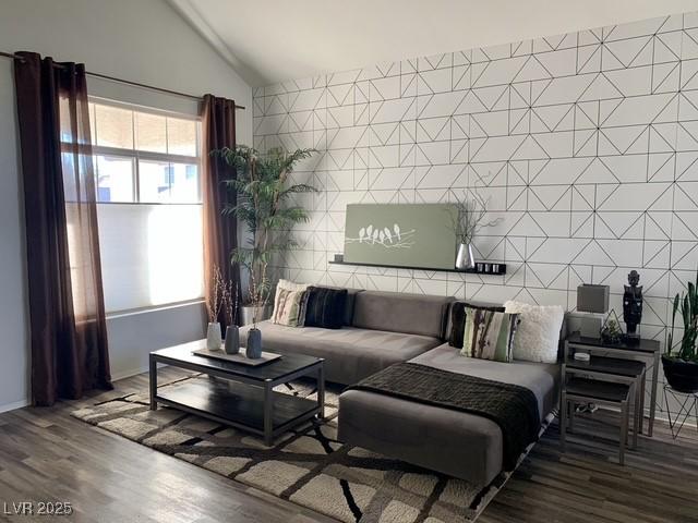 9485 Supernova Ct, Las Vegas, NV 89123 - living room with vaulted ceiling and wood finished floors