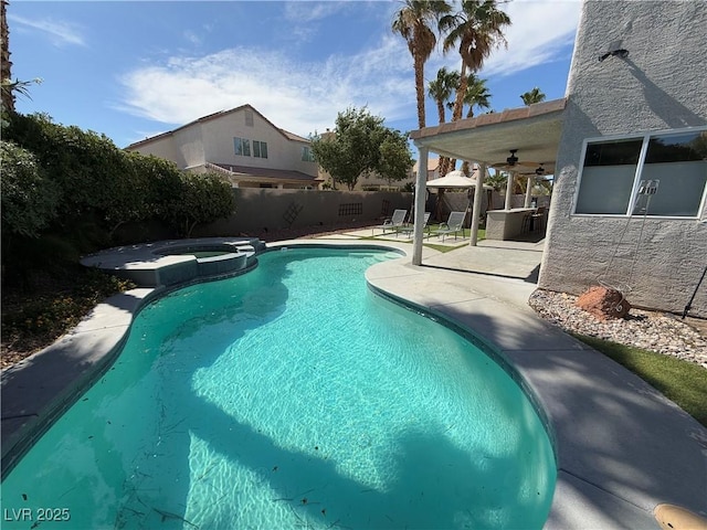 9485 Supernova Ct, Las Vegas, NV 89123 - view of pool with ceiling fan, a fenced backyard, a patio area, a pool with connected hot tub, and a gazebo