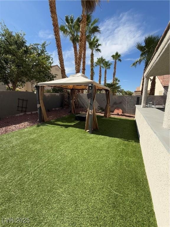9485 Supernova Ct, Las Vegas, NV 89123 - fenced backyard with a gazebo
