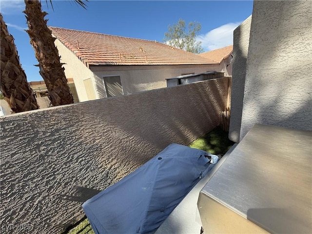 9485 Supernova Ct, Las Vegas, NV 89123 - exterior view of stucco siding and a tiled roof