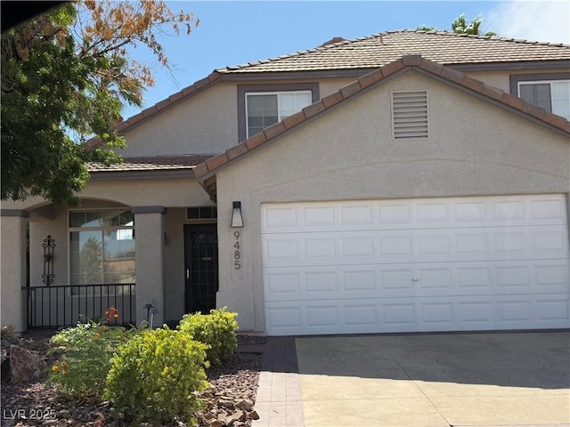 9485 Supernova Ct, Las Vegas, NV 89123 - view of front of property with an attached garage, driveway, stucco siding, and a tiled roof