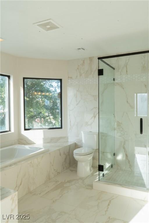 8740 Captains Pl, Las Vegas, NV 89117 - full bathroom featuring a bath, toilet, a marble finish shower, and marble tiled flooring