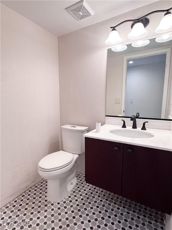 8740 Captains Pl, Las Vegas, NV 89117 - half bath featuring toilet and vanity