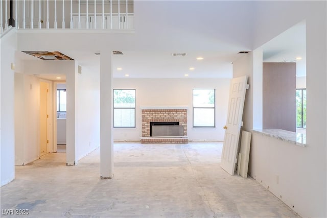8740 Captains Pl, Las Vegas, NV 89117 - unfurnished living room with a fireplace and recessed lighting