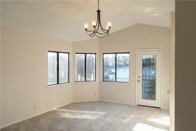 8740 Captains Pl, Las Vegas, NV 89117 - unfurnished room with a chandelier, light colored carpet, vaulted ceiling, a textured ceiling, and baseboards