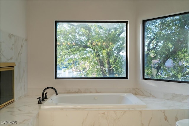 8740 Captains Pl, Las Vegas, NV 89117 - full bathroom with healthy amount of natural light and a garden tub