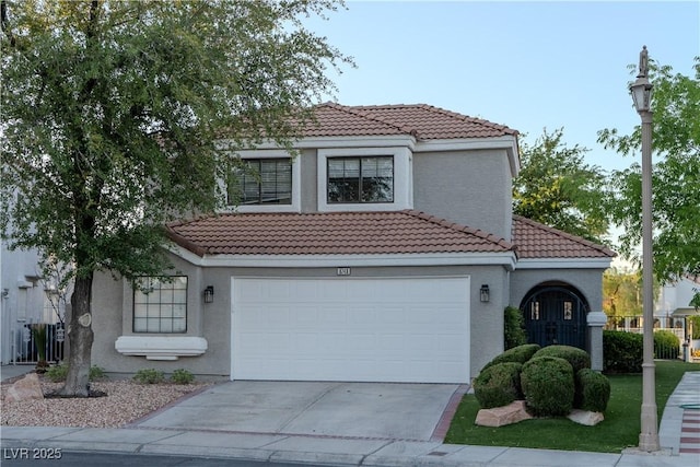 8740 Captains Pl, Las Vegas, NV 89117 - mediterranean / spanish home with a tile roof, driveway, and stucco siding
