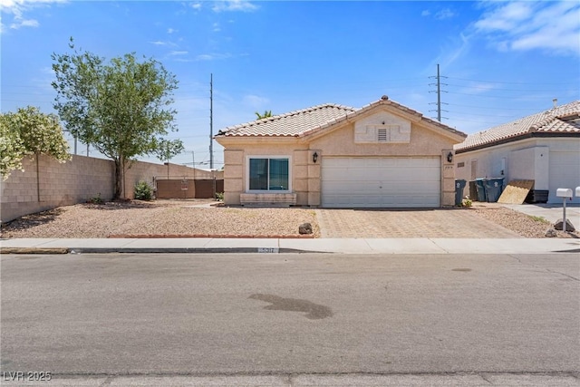 5317 Marietta Ave, Las Vegas, NV 89108 - view of front of property with a garage, stucco siding, driveway, and a tile roof