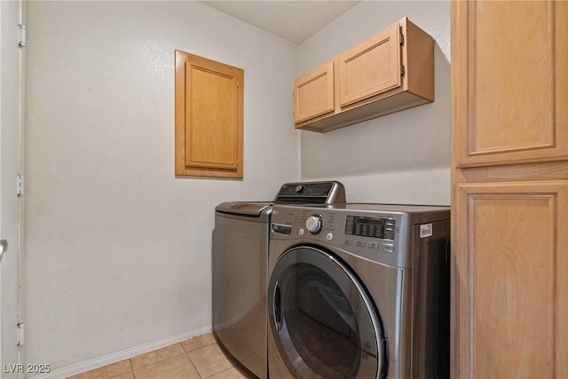 5317 Marietta Ave, Las Vegas, NV 89108 - laundry area with washing machine and dryer, cabinet space, baseboards, and light tile patterned flooring