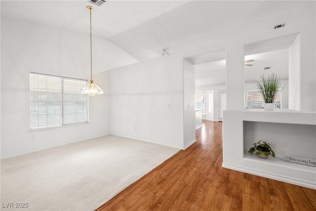 5704 Owl Butte Ct, Las Vegas, NV 89149 - spare room featuring a chandelier, baseboards, wood finished floors, and vaulted ceiling