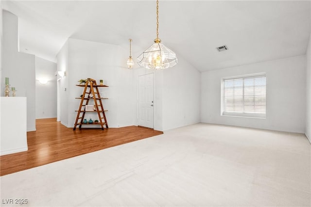 5704 Owl Butte Ct, Las Vegas, NV 89149 - carpeted empty room with wood finished floors, a chandelier, lofted ceiling, and baseboards