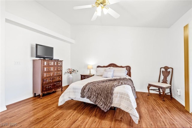 5704 Owl Butte Ct, Las Vegas, NV 89149 - bedroom with light wood-style floors, vaulted ceiling, baseboards, and a ceiling fan