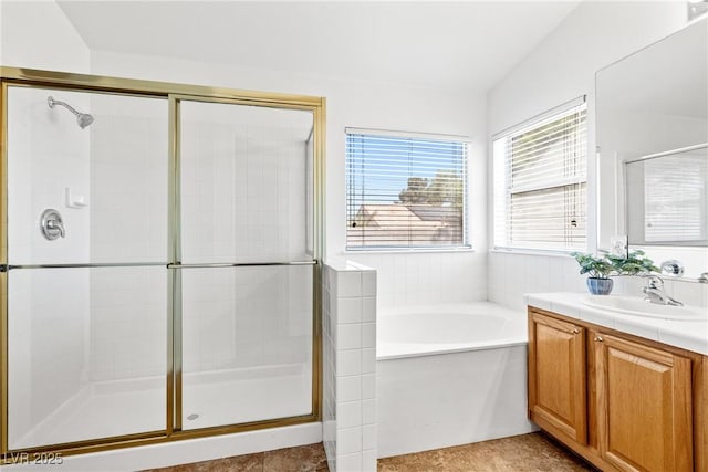 5704 Owl Butte Ct, Las Vegas, NV 89149 - bathroom featuring a garden tub, vanity, and a stall shower