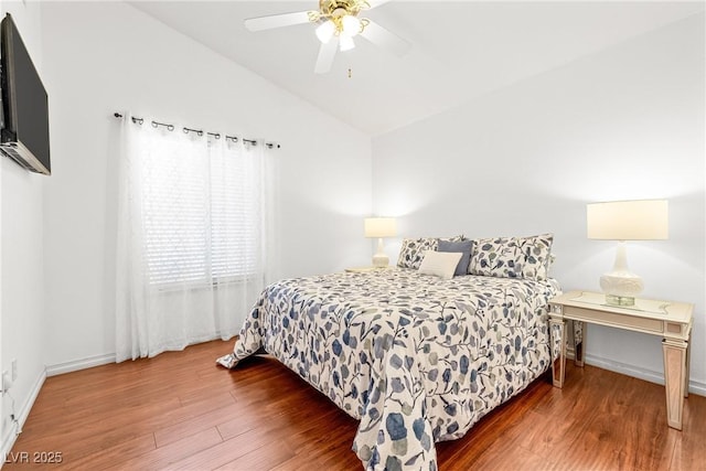 5704 Owl Butte Ct, Las Vegas, NV 89149 - bedroom featuring wood finished floors, lofted ceiling, baseboards, and a ceiling fan