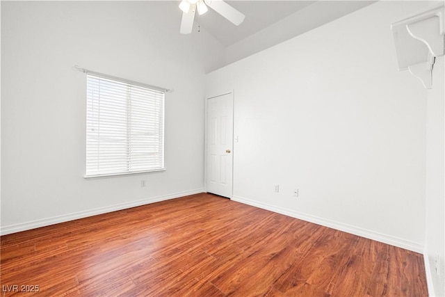 5704 Owl Butte Ct, Las Vegas, NV 89149 - spare room featuring ceiling fan, wood finished floors, vaulted ceiling, and baseboards
