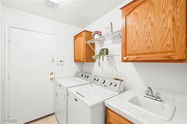 5704 Owl Butte Ct, Las Vegas, NV 89149 - laundry room featuring cabinet space and independent washer and dryer