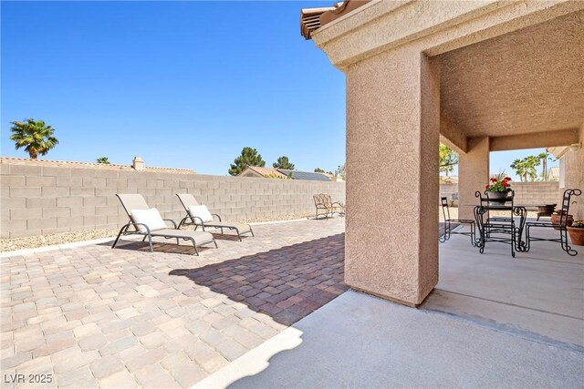 5704 Owl Butte Ct, Las Vegas, NV 89149 - fenced backyard with a patio area