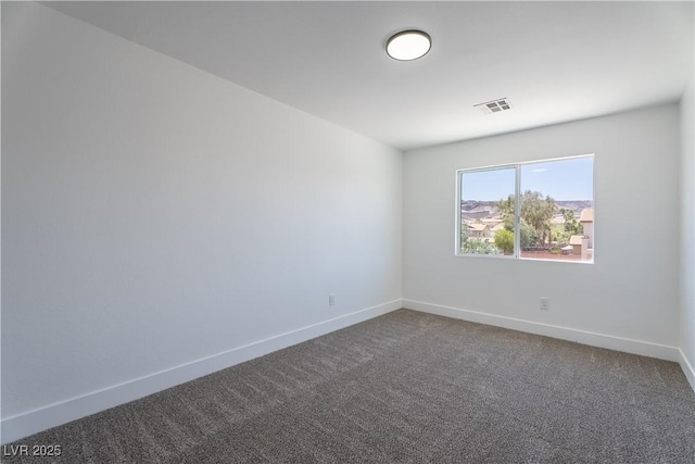 1136 Casady Hollow Ave, Henderson, NV 89012 - empty room featuring dark colored carpet and baseboards