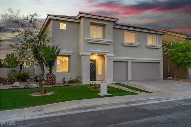 1136 Casady Hollow Ave, Henderson, NV 89012 - view of front of property featuring an attached garage, concrete driveway, stucco siding, roof mounted solar panels, and a yard