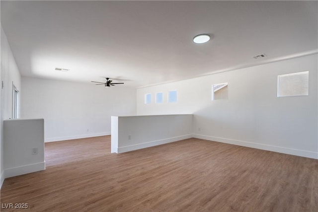 1136 Casady Hollow Ave, Henderson, NV 89012 - empty room featuring a ceiling fan, wood finished floors, and baseboards