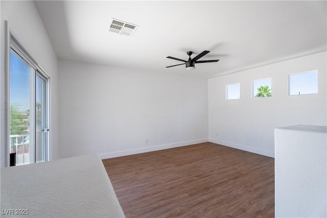 1136 Casady Hollow Ave, Henderson, NV 89012 - spare room with wood finished floors, ceiling fan, and baseboards