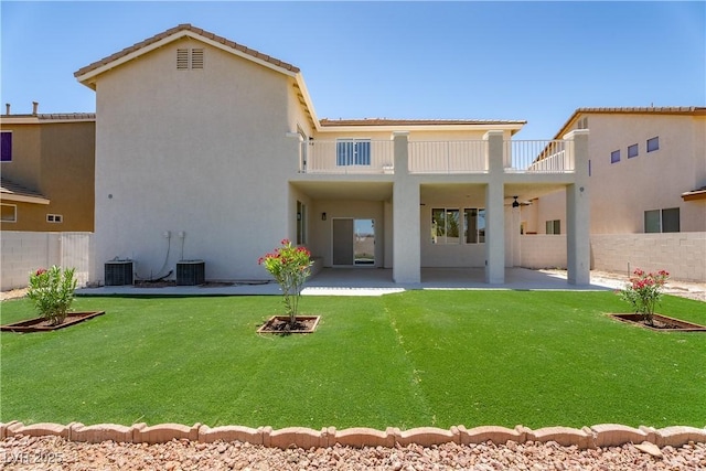 1136 Casady Hollow Ave, Henderson, NV 89012 - rear view of house featuring a balcony, a patio area, central AC unit, stucco siding, and a ceiling fan