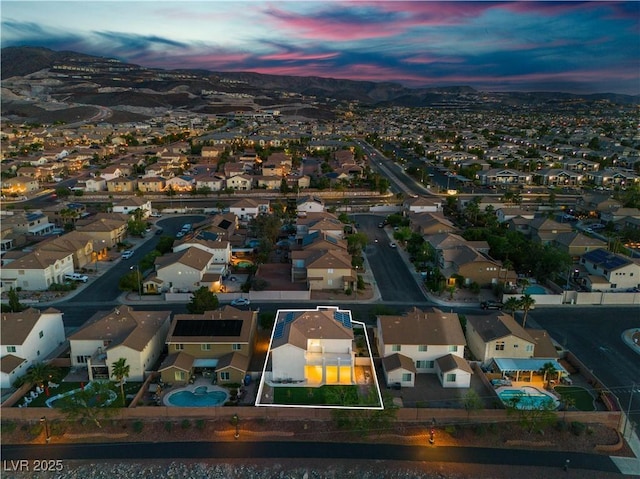 1136 Casady Hollow Ave, Henderson, NV 89012 - aerial view at dusk of a residential view, a mountain view, and property parcel outlined