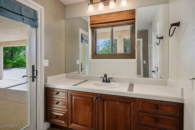 8365 S Hauck St, Las Vegas, NV 89139 - bathroom with plenty of natural light, vanity, and french doors