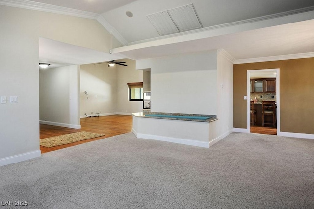 8365 S Hauck St, Las Vegas, NV 89139 - unfurnished room with carpet, crown molding, vaulted ceiling, baseboards, and a ceiling fan