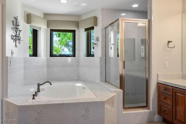 8365 S Hauck St, Las Vegas, NV 89139 - bathroom featuring a bath, a shower stall, vanity, and recessed lighting