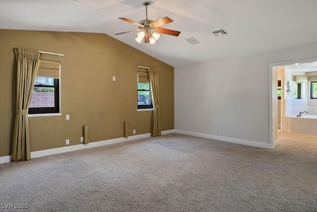 8365 S Hauck St, Las Vegas, NV 89139 - carpeted empty room featuring ceiling fan, lofted ceiling, and baseboards