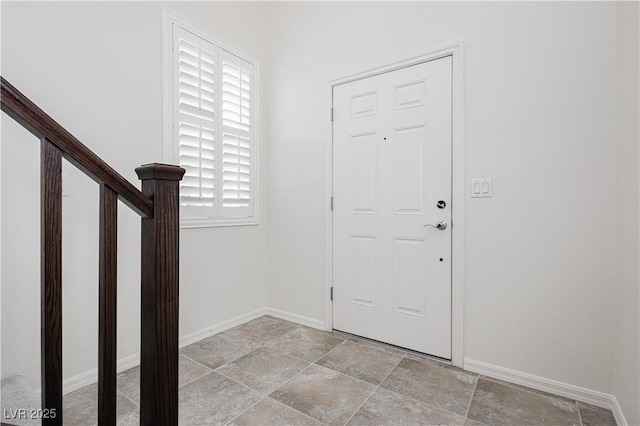 1185 Via Dimartini, Henderson, NV 89052 - entrance foyer featuring baseboards, light stone finish floors, and stairs