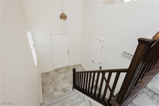 1185 Via Dimartini, Henderson, NV 89052 - entryway featuring a high ceiling, stairs, and baseboards