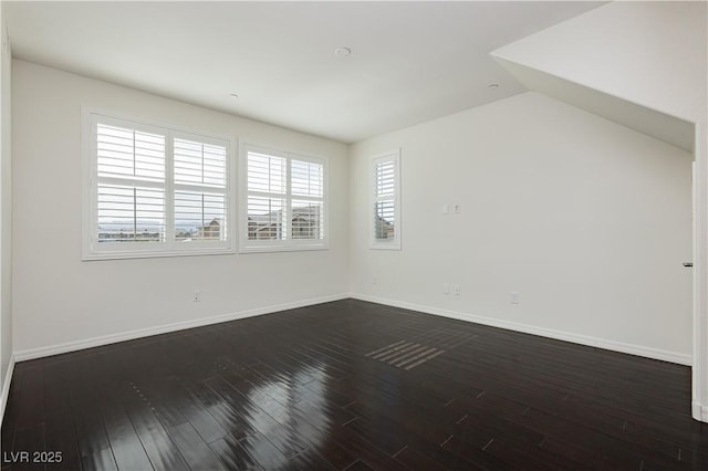 1185 Via Dimartini, Henderson, NV 89052 - unfurnished room with dark wood-style floors, baseboards, and vaulted ceiling